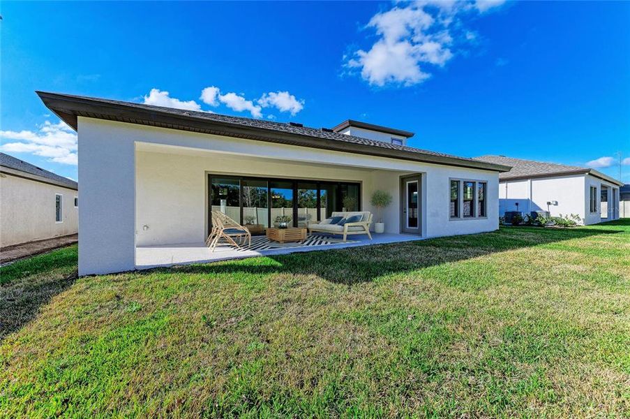 Exterior details and patio area of a home in Crosswind Point, Parrish (Image 22). Exterior details and patio area of a home in Crosswind Point, Parrish (Image 22).