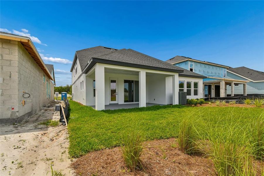 Exterior details and patio area of a home in Oakfield at Mount Dora Village Series, Mount Dora (Image 19).