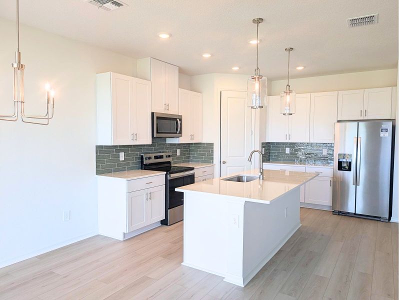 Furnished interior view inside a new home in Coasterra - Reserve Series, Palmetto (Image 3).
