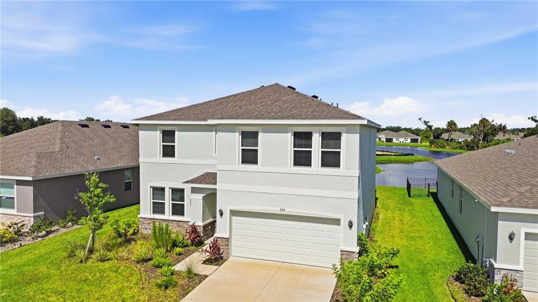 Front exterior of a new home in Coddington, Bradenton, FL, highlighting curb appeal (Image 29).