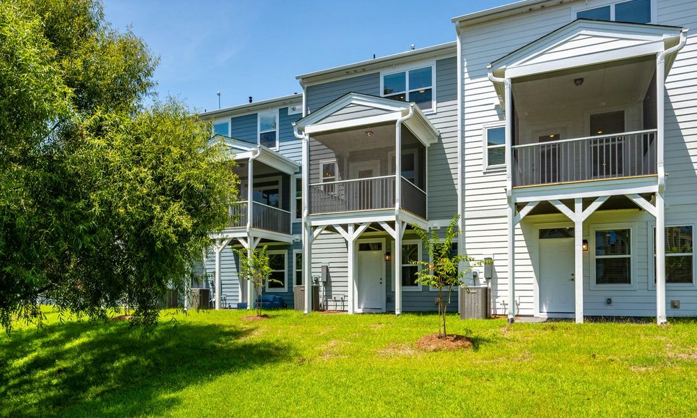 Exterior details and patio area of a home in The Bluffs at Pinefield Townhomes, Charleston (Image 20).