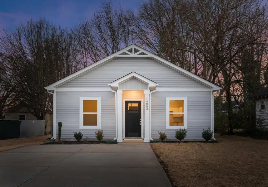 Front exterior of a new home in , North Charleston, SC, highlighting curb appeal (Image 1). Front exterior of a new home in , North Charleston, SC, highlighting curb appeal (Image 1).