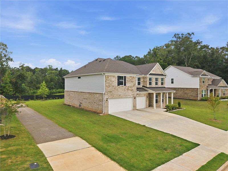 Front exterior of a new home in , McDonough, GA, highlighting curb appeal (Image 30). Front exterior of a new home in , McDonough, GA, highlighting curb appeal (Image 30).