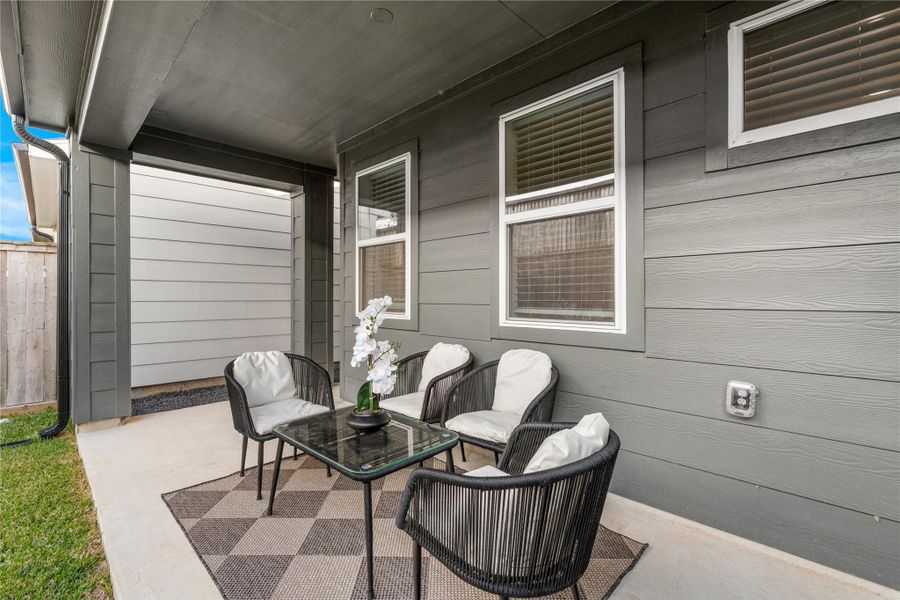 The covered patio adds valuable extra space in the backyard, making it easy to host friends, set up outdoor seating, or enjoy time outside without worrying about the sun or rain.