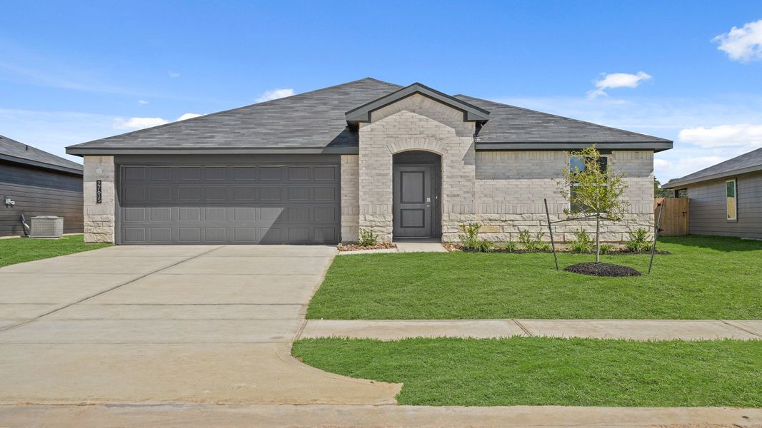 Front exterior of a new home in Grand Pines, Magnolia, TX, highlighting curb appeal (Image 2). Front exterior of a new home in Grand Pines, Magnolia, TX, highlighting curb appeal (Image 2).