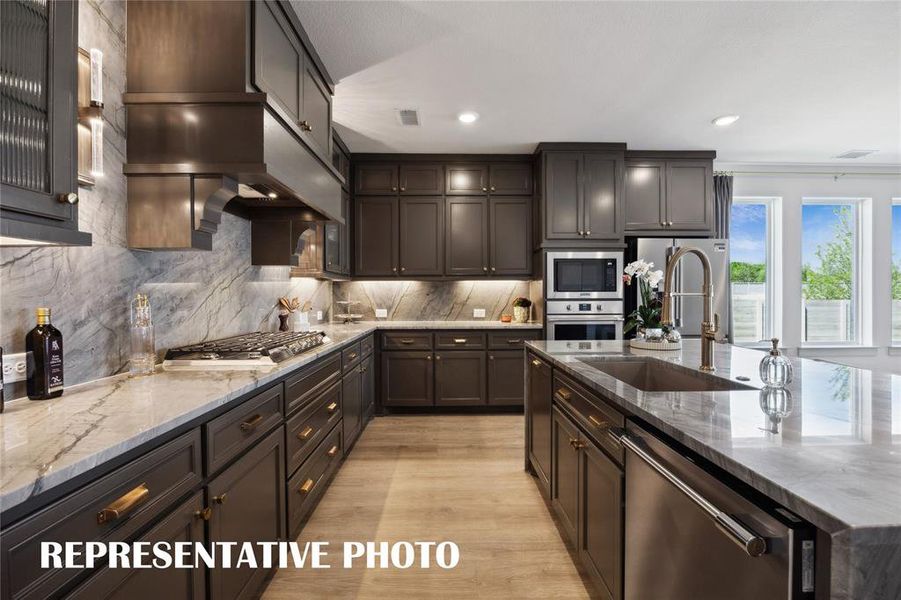 Beautiful cabinetry, gorgeous countertops, top of the line stainless steel appliances....this stunning kitchen is everything you have been searching for!  REPRESENTATIVE PHOTO