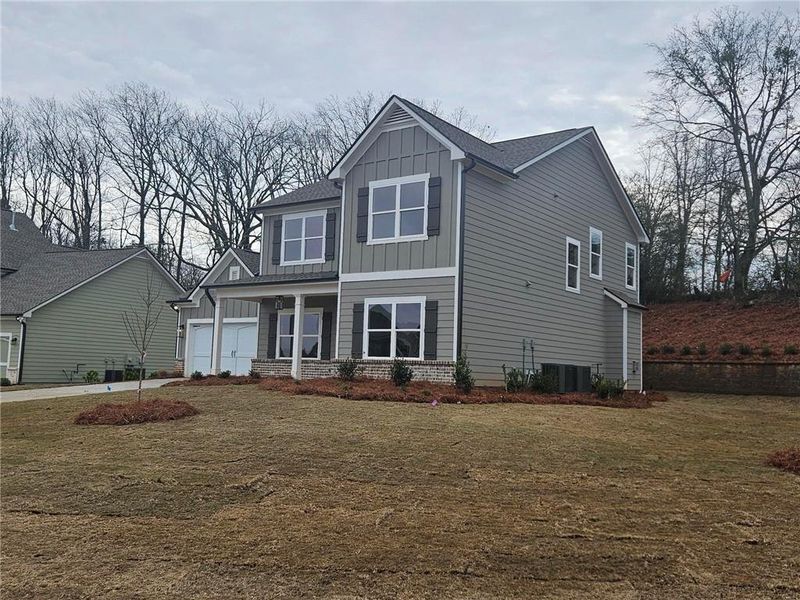 Front exterior of a new home in Calgary Downs, Winder, GA, highlighting curb appeal (Image 19).