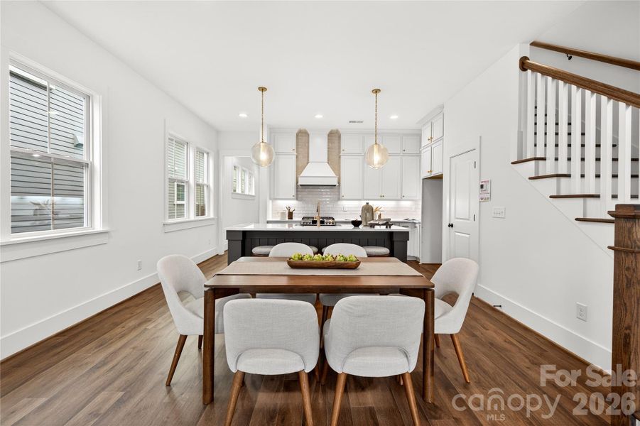 This spacious dining and kitchen area with 10-foot ceilings is perfect for gatherings.