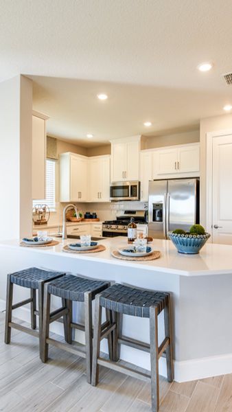 Furnished interior view inside a new home in Esplanade at Kingston, Estero (Image 10).