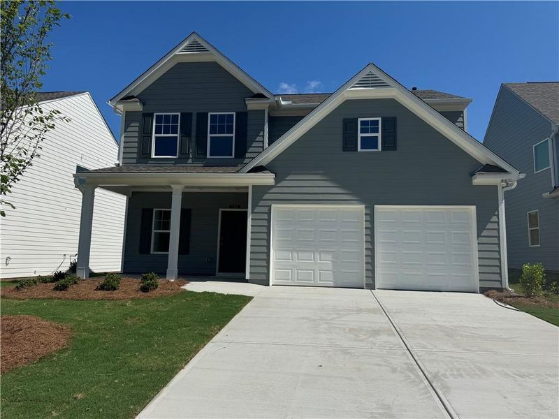 Front exterior of a new home in The Reserve at Willow Oaks, Canton, GA, highlighting curb appeal (Image 1). Front exterior of a new home in The Reserve at Willow Oaks, Canton, GA, highlighting curb appeal (Image 1).