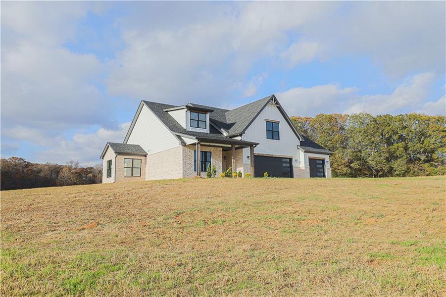 Front exterior of a new home in , Maysville, GA, highlighting curb appeal (Image 20). Front exterior of a new home in , Maysville, GA, highlighting curb appeal (Image 20).