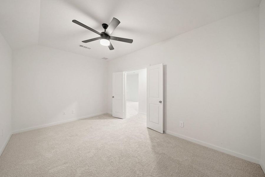 The entertainment room features elegant double doors and a ceiling fan, creating a comfortable and private space for relaxation and fun. The entertainment room features elegant double doors and a ceiling fan, creating a comfortable and private space for relaxation and fun.