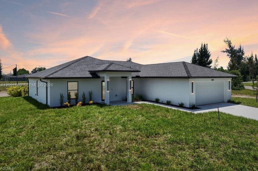 Front exterior of a new home in , Cape Coral, FL, highlighting curb appeal (Image 22). Front exterior of a new home in , Cape Coral, FL, highlighting curb appeal (Image 22).