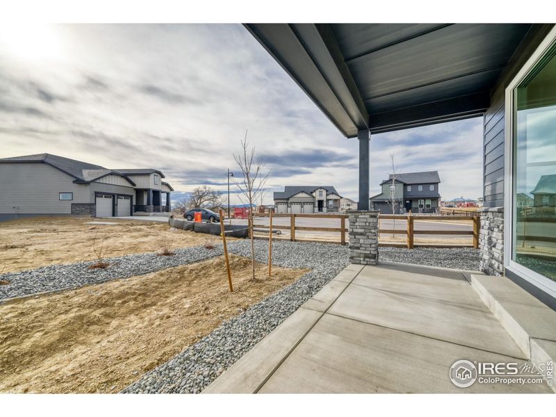 Exterior details and patio area of a home in Barefoot Lakes, Firestone (Image 18).