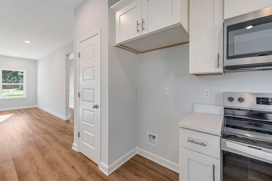 Furnished interior view inside a new home in Live Oak Cottages, Freeport (Image 10).