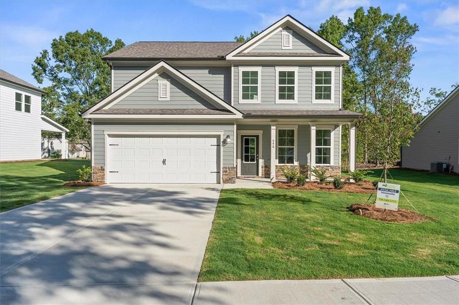 Front exterior of a new home in Ellington Farms, Statham, GA, highlighting curb appeal (Image 1). Front exterior of a new home in Ellington Farms, Statham, GA, highlighting curb appeal (Image 1).