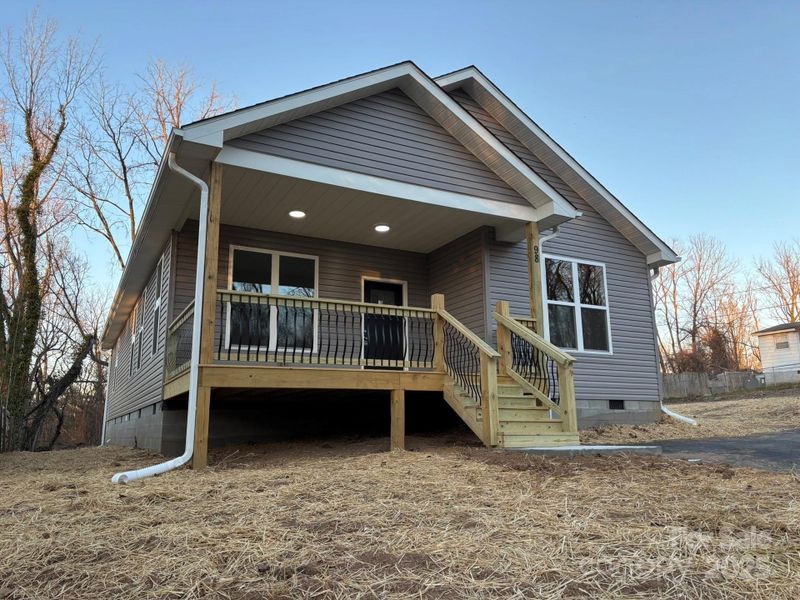Welcoming front porch with easy access from paved 2-car drive. Welcoming front porch with easy access from paved 2-car drive.