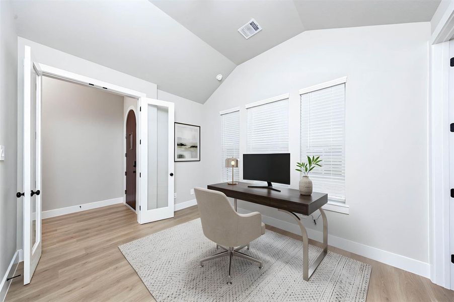 This handsome home office features tile flooring, large windows, cathedral ceilings, custom paint, walk-in closet, and gorgeous French doors for added privacy! *Virtually Staged This handsome home office features tile flooring, large windows, cathedral ceilings, custom paint, walk-in closet, and gorgeous French doors for added privacy! *Virtually Staged