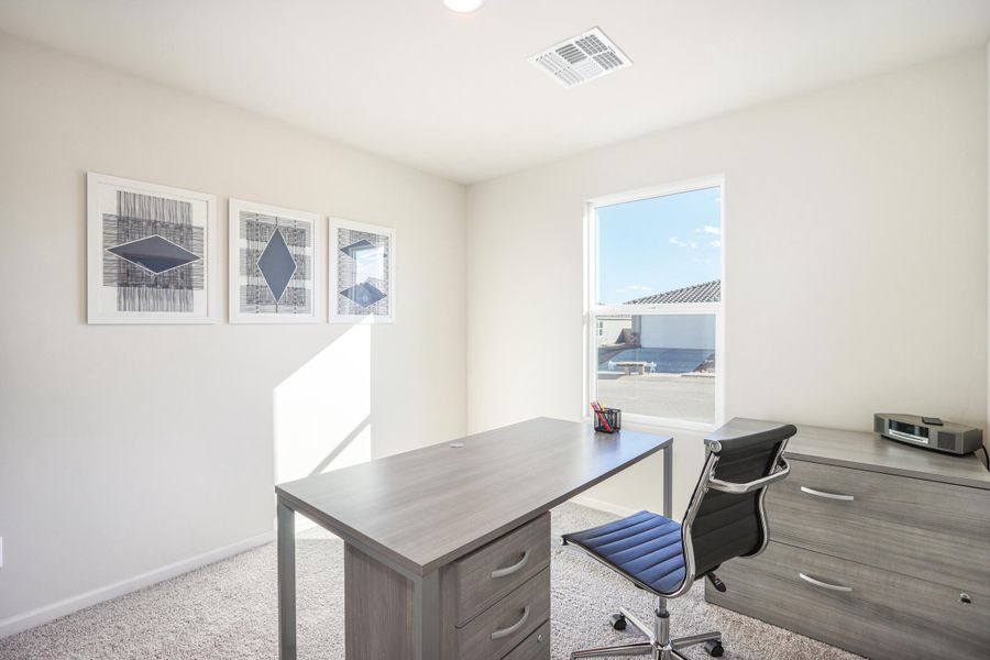 A room with a desk and chairs. A room with a desk and chairs.