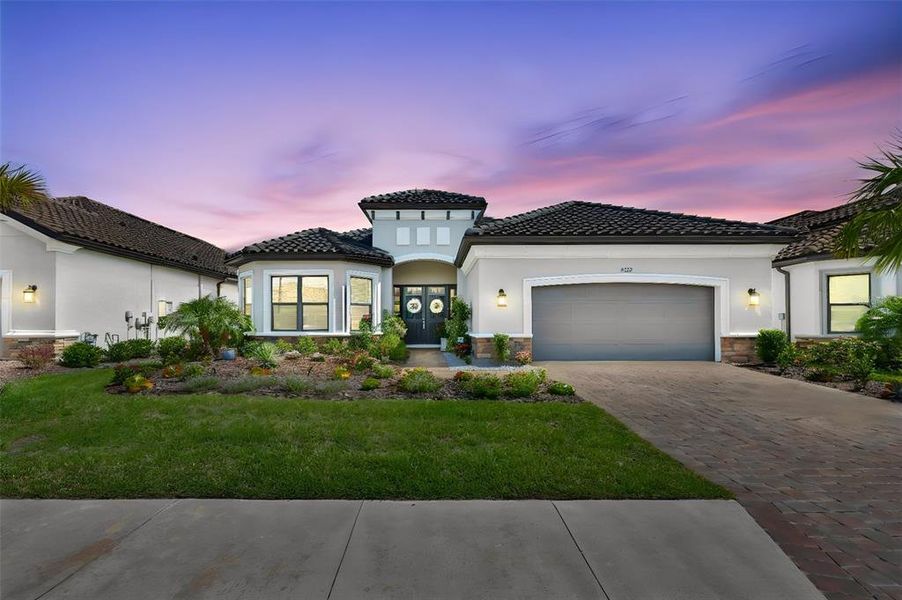 Front exterior of a new home in Esplanade at Artisan Lakes, Palmetto, FL, highlighting curb appeal (Image 22).