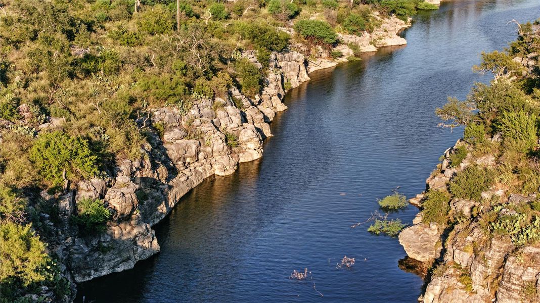 View of community property location featuring a nearby body of water