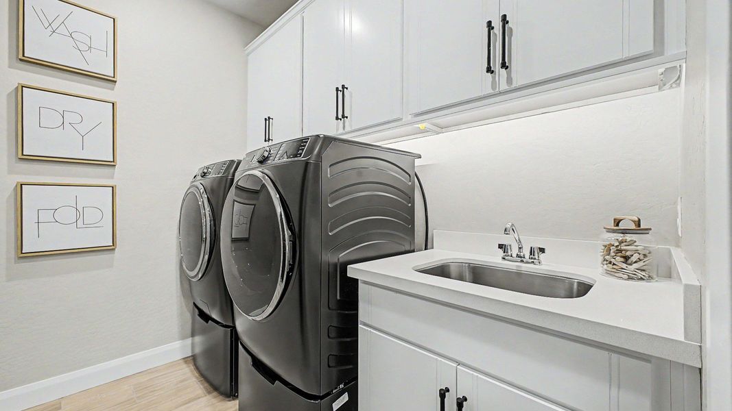 Functional laundry room in this quick move-in new home by DRB Homes at Saguaro Hills at Vistancia, 32407 N 123rd Dr. Functional laundry room in this quick move-in new home by DRB Homes at Saguaro Hills at Vistancia, 32407 N 123rd Dr.