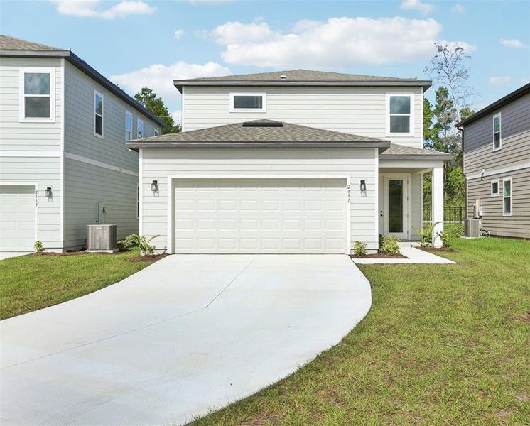 Front exterior of a home in the Ellington Classical community, located in St. Cloud, FL (Image 9).