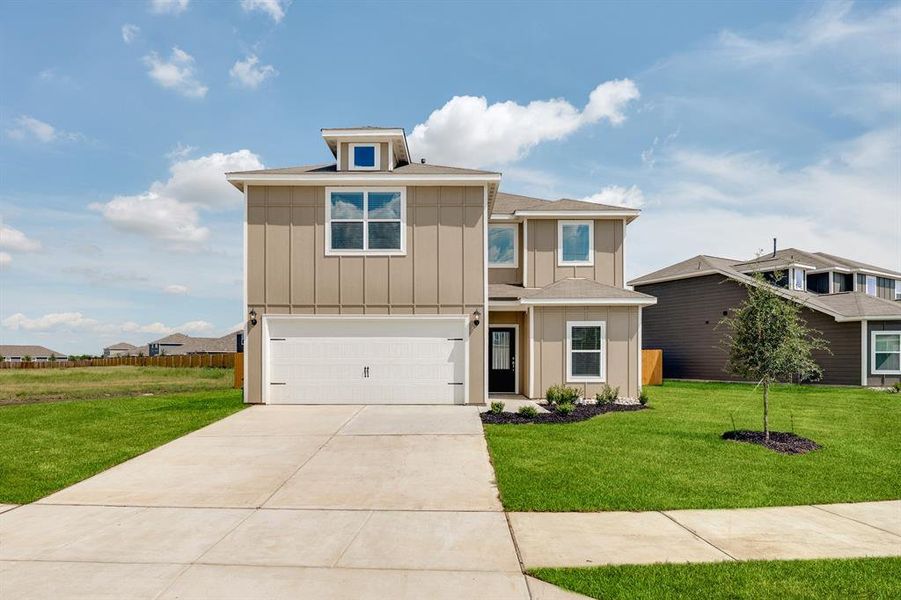 View of front of house featuring a garage, roof with shingles, driveway, and board and batten siding