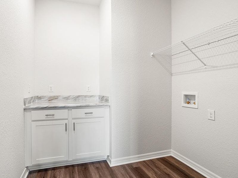 This home also has a mud room off the golf cart garage, a dedicated laundry room, and a half-bath for guests.