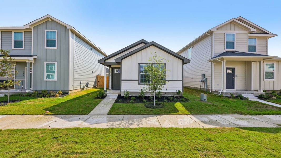 Front exterior of a new home in Valverde, Bastrop, TX, highlighting curb appeal (Image 2).