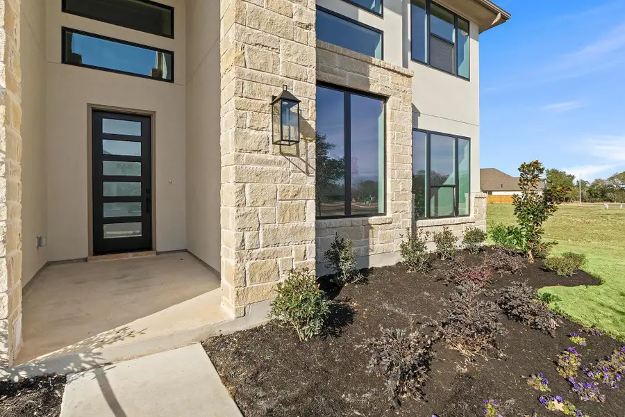 Exterior details and patio area of a home in Parmer Ranch, Georgetown (Image 3).