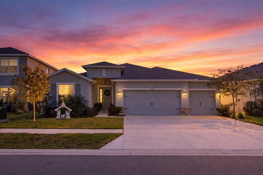 Front exterior of a new home in Deerbrook, Land O' Lakes, FL, highlighting curb appeal (Image 2). Front exterior of a new home in Deerbrook, Land O' Lakes, FL, highlighting curb appeal (Image 2).