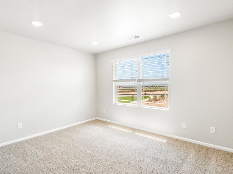 Secondary bedroom in the Wateron floorplan at a Meritage Homes community in Brighton, CO.