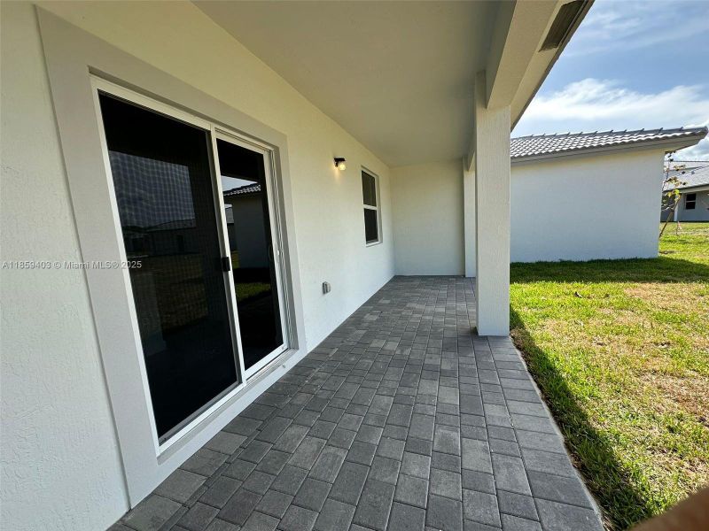 Exterior details and patio area of a home in Hawthorne at Galiano Pointe, Miami (Image 14).