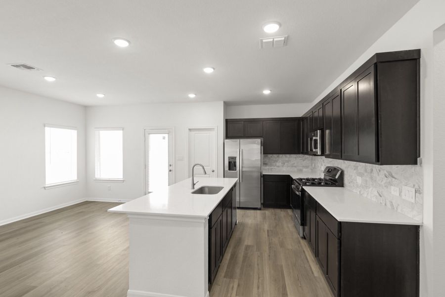 Furnished interior view inside a new home in Village at Three Oaks, Seguin (Image 8).