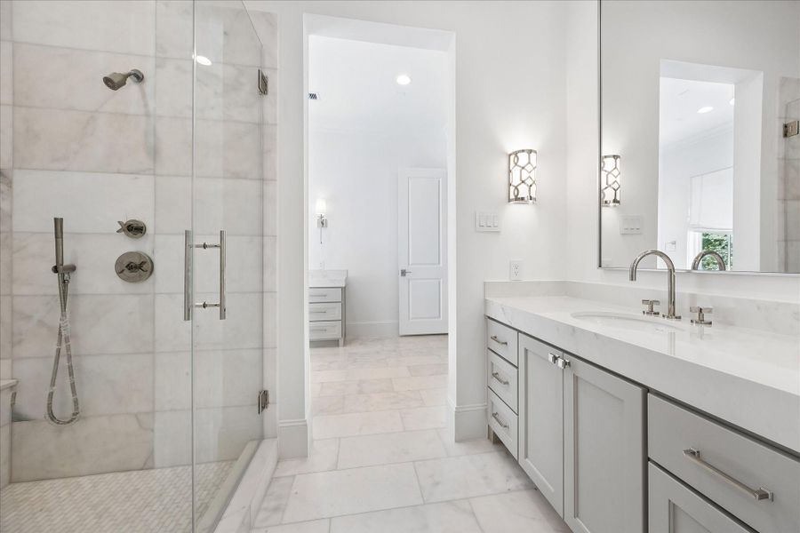 Second vanity space also has an oversized mirror and additional storage.