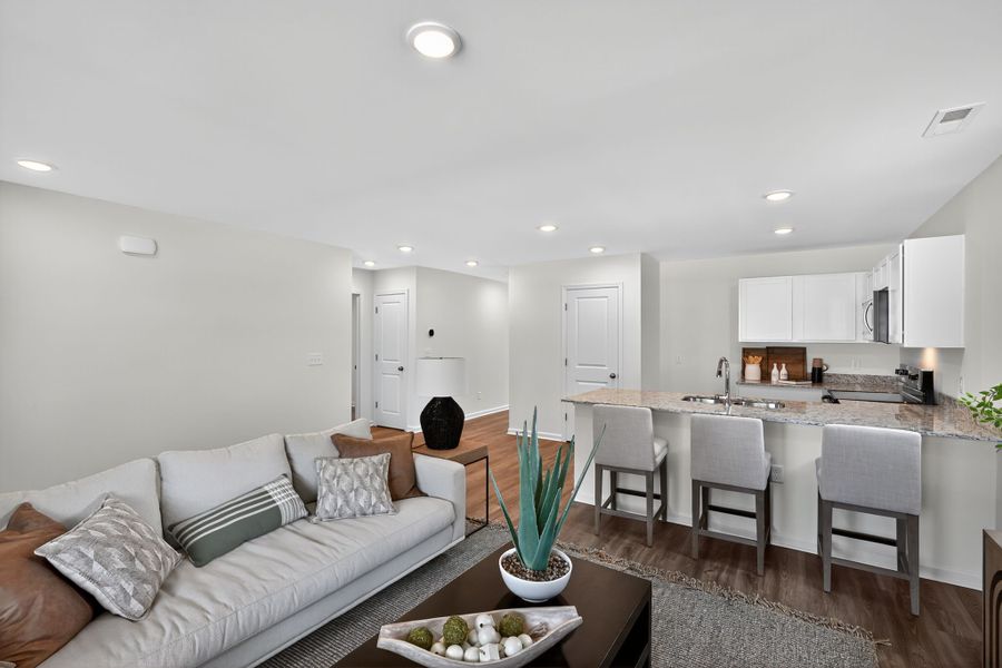 A living room with a couch and a table.