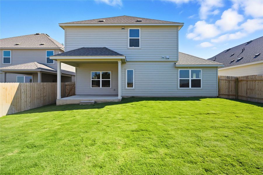 Back of property featuring a shingled roof, a patio, and a fenced backyard Back of property featuring a shingled roof, a patio, and a fenced backyard