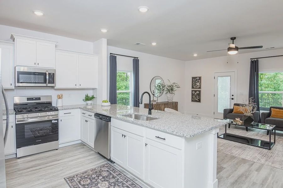 Representative furnished interior of a home built from the 1557 Townhome by Adams Homes in Parkstone Place Townhomes, Roebuck (Image 5).