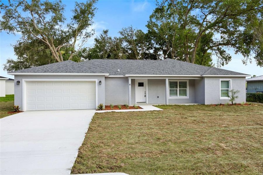 Front exterior of a new home in , Ocala, FL, highlighting curb appeal (Image 28). Front exterior of a new home in , Ocala, FL, highlighting curb appeal (Image 28).