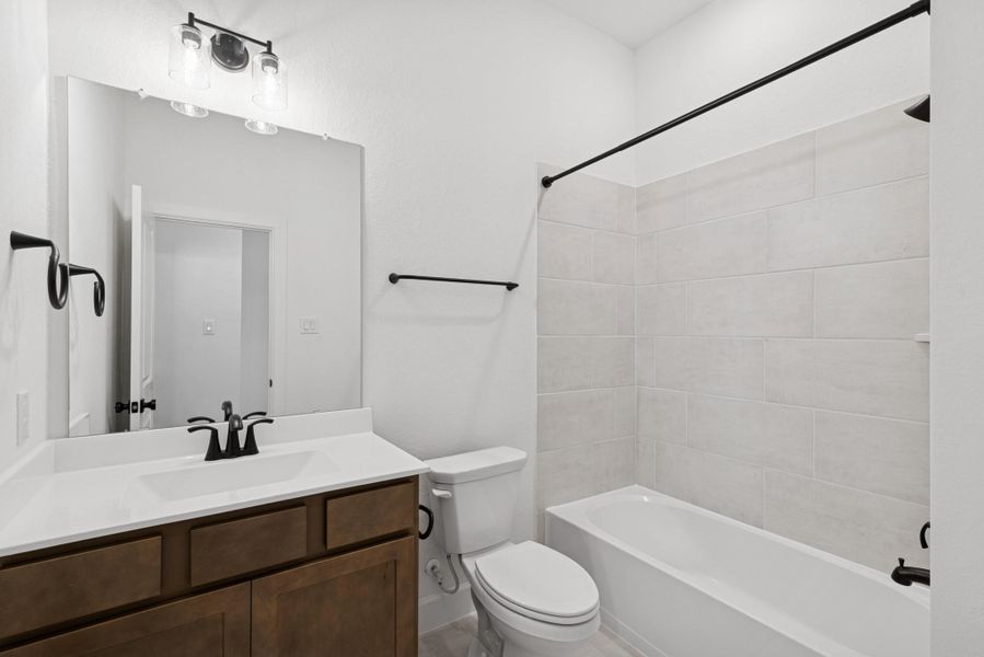 Furnished interior view inside a new home in Meridiana 55' Homesites, Manvel (Image 10).