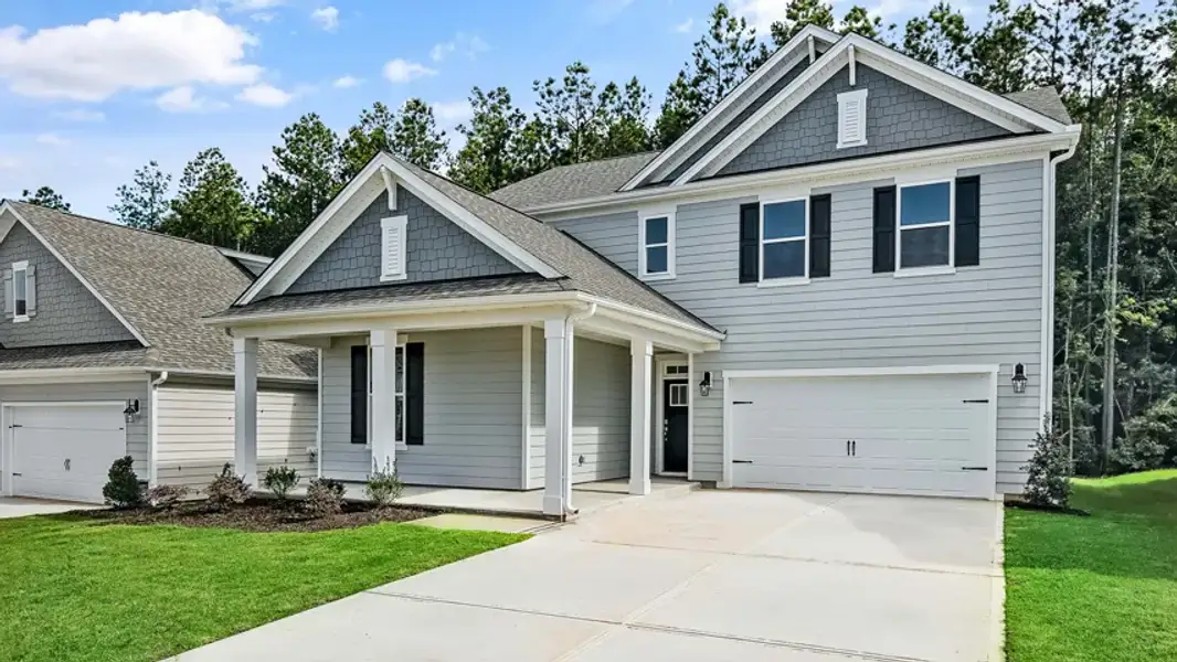 Front exterior of a new home in Horton Park, Apex, NC, highlighting curb appeal (Image 18).