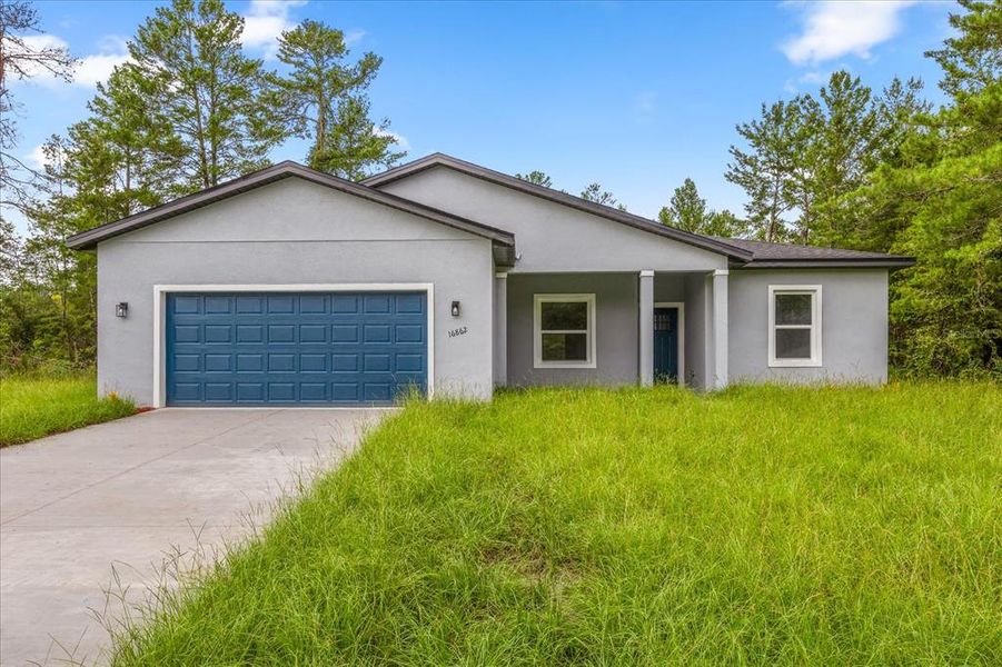 Front exterior of a new home in , Ocala, FL, highlighting curb appeal (Image 21). Front exterior of a new home in , Ocala, FL, highlighting curb appeal (Image 21).