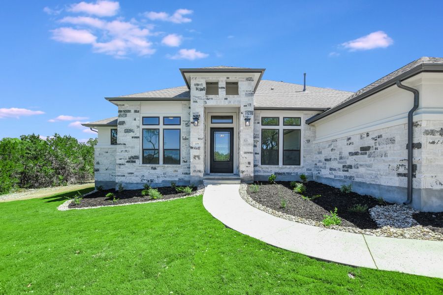 Representative exterior photo of a completed home built from the San Simeon I by Giddens Homes in Clearwater Ranch, Liberty Hill, TX (Image 60).