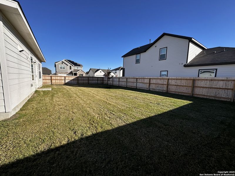 Exterior details and patio area of a home in Hennersby Hollow, San Antonio (Image 2).