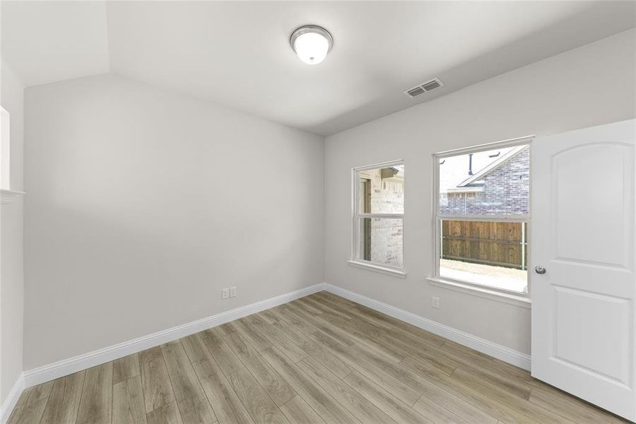 Unfurnished room with light hardwood / wood-style floors