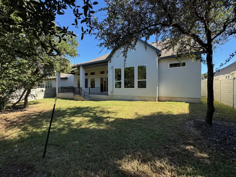 Back of house with stucco siding