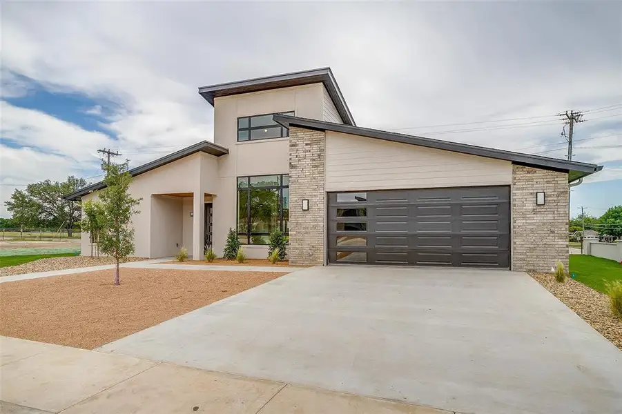 Front exterior of a new home in , Mineral Wells, TX, highlighting curb appeal (Image 2). Front exterior of a new home in , Mineral Wells, TX, highlighting curb appeal (Image 2).