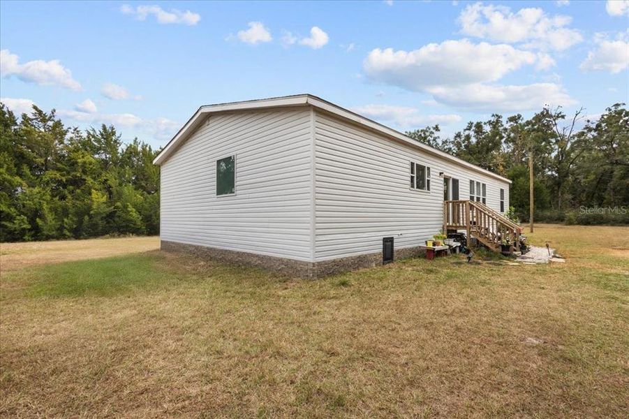 Exterior details and patio area of a home in , Bell (Image 10).