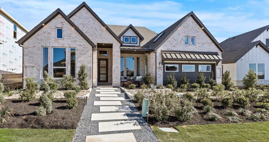 Representative exterior photo of a completed home built from the Malia by Chesmar Homes in Sunfield, Buda, TX (Image 1).
